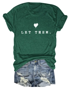 Deep green crewneck T-shirt with LET THEM print paired with distressed denim shorts