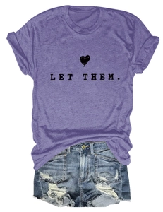 Detail of purple cotton T-shirt with 'LET THEM.' text and distressed denim shorts
