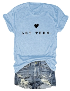 Detail of light blue crew neck T-shirt with 'LET THEM' text and heart graphic print