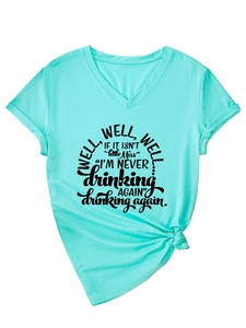 Detail of mint green V-neck T-shirt showing knotted hem and funny letter print