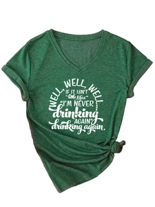 Detail of dark green V-neck T-shirt featuring white letter print and front knot hem
