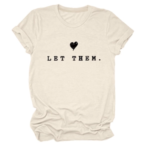 Close-up of cream crew neck T-shirt with heart print and LET THEM text design
