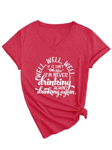 Close-up of red V-neck T-shirt showing letter print and front knot detail on fabric