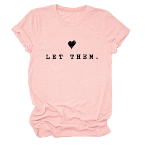 Detailed close-up of pink round neck T-shirt with black LET THEM text and heart print