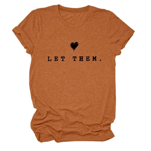 Close-up of LET THEM text print and black heart on orange cotton crewneck t-shirt