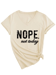 Detail of the V-neck shirt showing the NOPE text and the stylish side knot design