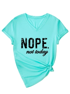 Close-up of mint green V-neck T-shirt featuring NOPE not today print and knotted hem