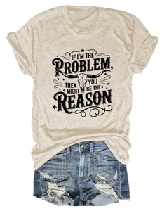 Close-up of distressed denim shorts and beige t-shirt with bull skull print detail