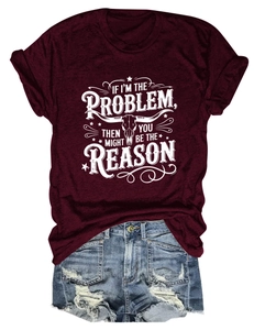 Flat lay of a burgundy crew neck T-shirt with bull skull print and ripped denim shorts