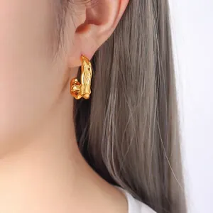 Modern 18K gold plated C-shaped earrings with irregular textured molten metal design