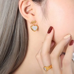 Elegant gold heart earrings with micro-pave zircons and matching stone set ring