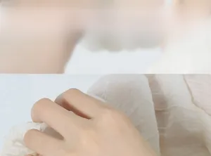 Detailed macro view of white pleated fabric texture with a minimalist handmade aesthetic