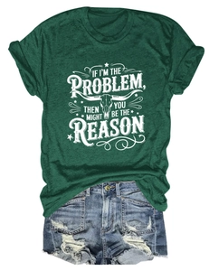 Flat lay of a green graphic T-shirt with skull print and distressed denim shorts