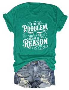 Flat lay of green t-shirt with bull skull print and distressed blue denim shorts