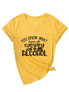 Detail of V-neck yellow camping t-shirt with rolled sleeves and front knot design