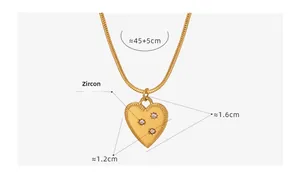 Detail of 18K gold plated heart pendant necklace with zircon inlay and snake chain