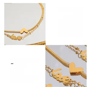 Détail de la chevillère double couche en acier titane plaqué or 18 carats avec cœur