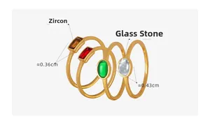 Macro view of gold titanium rings set with colorful square and oval gemstones