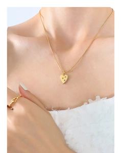 Detailed macro view of 18K gold plated heart pendant necklace with zircon inlay