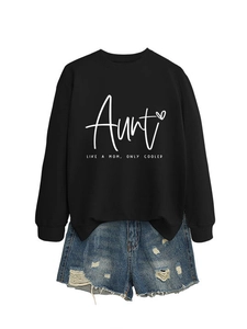 Detail of black crewneck sweatshirt with Aunt lettering and ripped denim shorts set