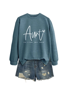 Detail of blue long sleeve sweatshirt with Aunt Like A Mom print and denim shorts