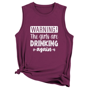 Detail of fuchsia sleeveless top with side knot and Warning The Girls printing