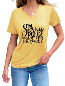 Detail of V-neck mustard yellow T-shirt with black slogan print and soft cotton texture
