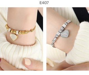Detail of beaded heart pendant bracelets in gold and silver finish with pavé rhinestones