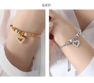 Detail of 18K gold and silver plated heart charm bracelets with micro-pave crystal settings
