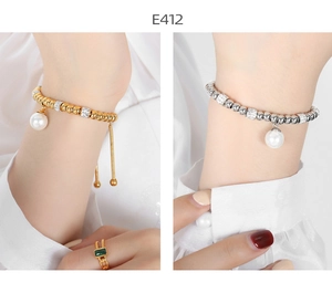 Detailed close-up of adjustable bead bracelets with crystals and large pearl drops