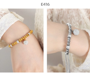Detailed macro view of 18K gold and silver beaded bracelets with micro-pave charms