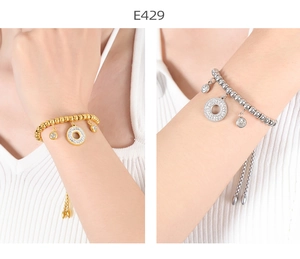 Detailed view of adjustable geometric bracelets with diamond pendants in gold and silver finish