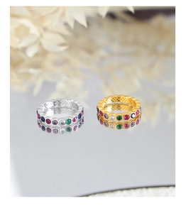 Eternity rings in gold and silver finish with colorful cubic zirconia on mirror surface