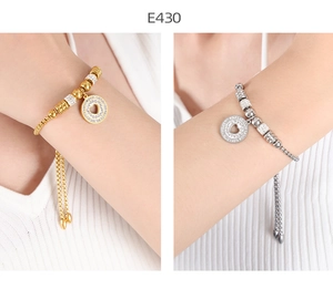 Detail of 18K gold plated heart charm bracelet with adjustable slider and pavé diamonds