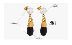 Close-up of vintage pearl and drop-shaped glass stone earrings with size 4.2cm by 0.9cm