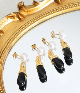 Three pairs of elegant vintage earrings with white pearls and black waterdrop pendants