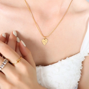 Elegant 18K gold plated snake chain necklace featuring a zircon inlaid heart pendant