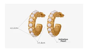 Detailed view of vintage C-shaped gold earrings with white pearls and 2.2cm size measurement