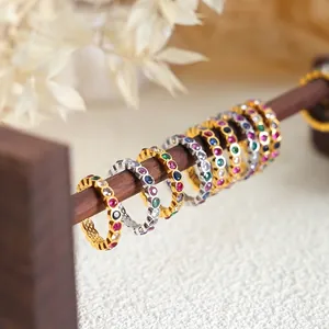 Eternity rings with colorful cubic zirconia stones on gold and silver bands