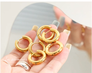 Detailed view of six 18K gold plated hoop earrings with micro-inlaid cubic zirconia accents