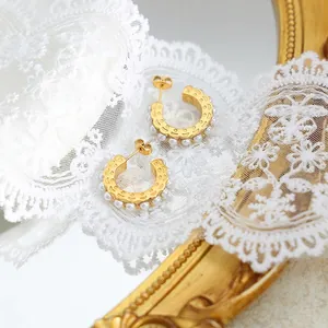 18K gold plated C-shaped earrings with imitation pearls and hollow wavy pattern on lace