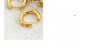 Macro view of 18K gold plated hoop earrings with micro-pave cubic zirconia inlay