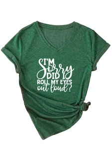 Detail of V-neck dark green t-shirt with knotted side hem and white slogan print