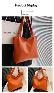 Details einer orangefarbenen großen Shopper-Tasche mit strukturierter Kunstleder-Optik