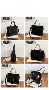 Detailed six-angle view of black matte tote bag with brown straps and dual zip pockets