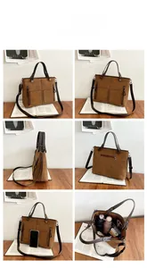 Brown frosted leather tote bag detail with multiple pockets and spacious interior