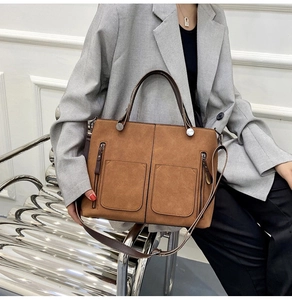 Caramel brown matte leather tote bag shown with model for a professional commuter style