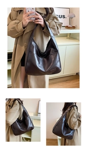 Detail view of the deep brown leather tote bag showing side pockets and shoulder strap