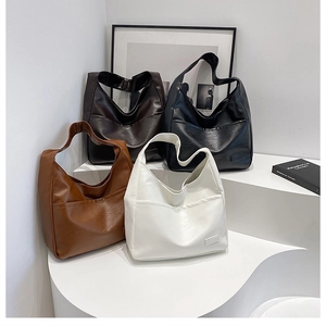 Detailed display of vintage hobo bags in black, brown, caramel and white leather colors
