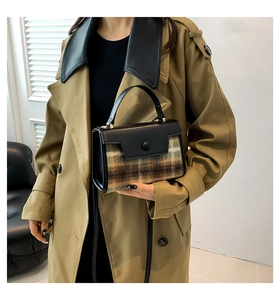 Detailed view of vintage plaid pattern and premium leather finish on the crossbody handbag